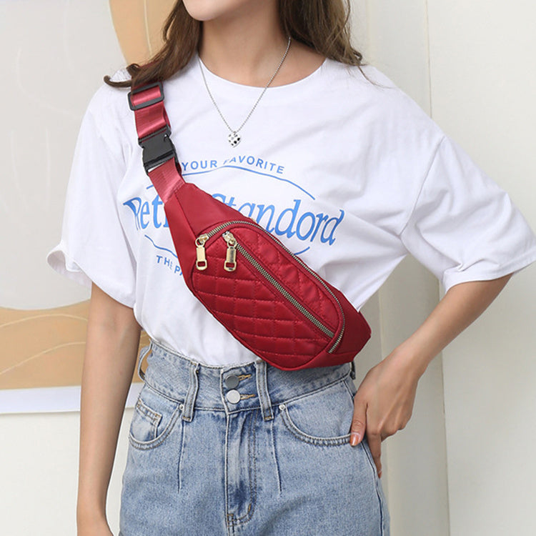 Trendy women’s nylon fanny pack with multiple pockets. Lightweight, durable crossbody waist bag perfect for running, hiking, cycling, and travel.