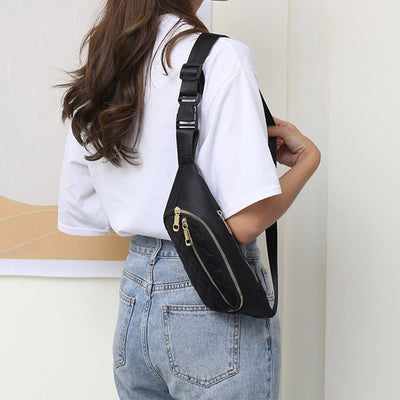 Trendy women’s nylon fanny pack with multiple pockets. Lightweight, durable crossbody waist bag perfect for running, hiking, cycling, and travel.